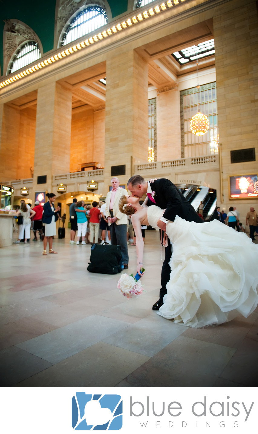 Bride and groom kissing in Grand Central Terminal NYC