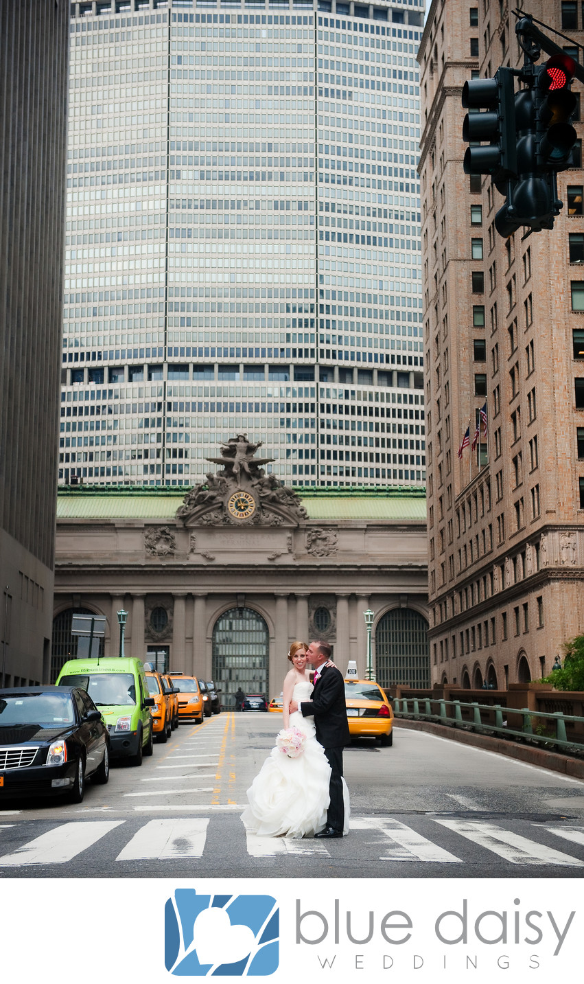 Bride groom standing in front of Grand Central Terminal