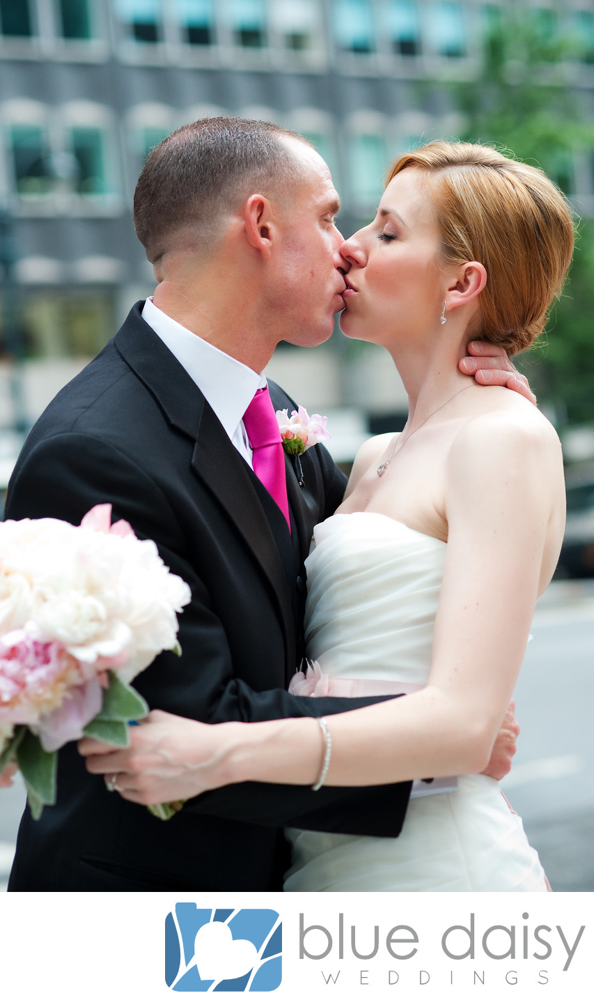Manhattan wedding couple share passionate kiss