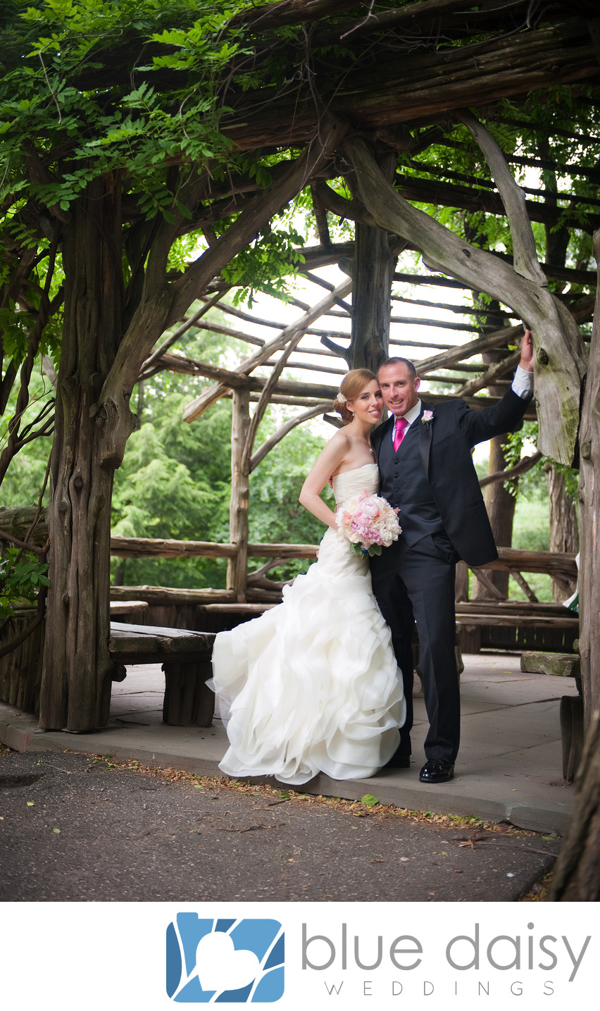 Bride groom in Central Park wooden gazebo