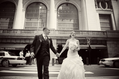 Bride groom walking laughing in front of Grand Central