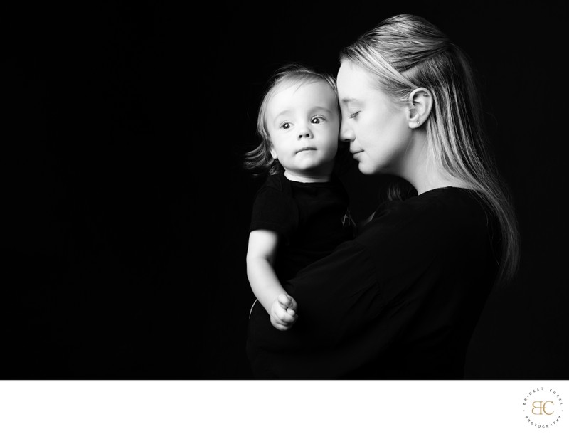 Mother Holding Son in Quiet Black and White