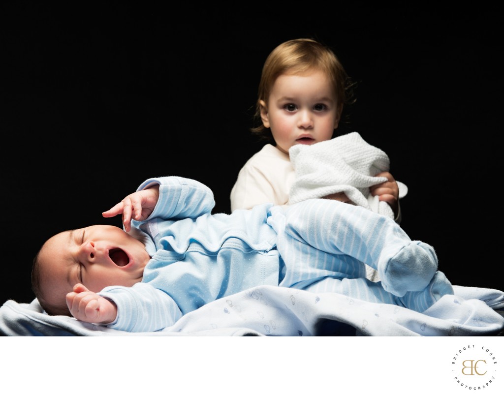 Yawning Baby With Sibling