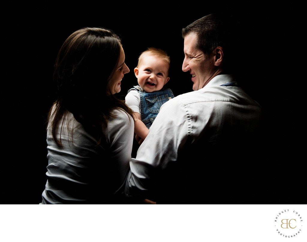 Smiling Baby Posing With Parents