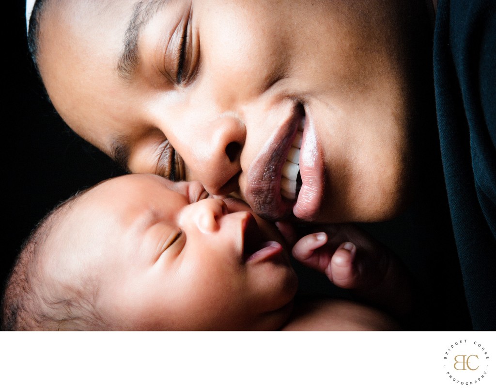 Newborn and Mom Smiling Cheek To Cheek