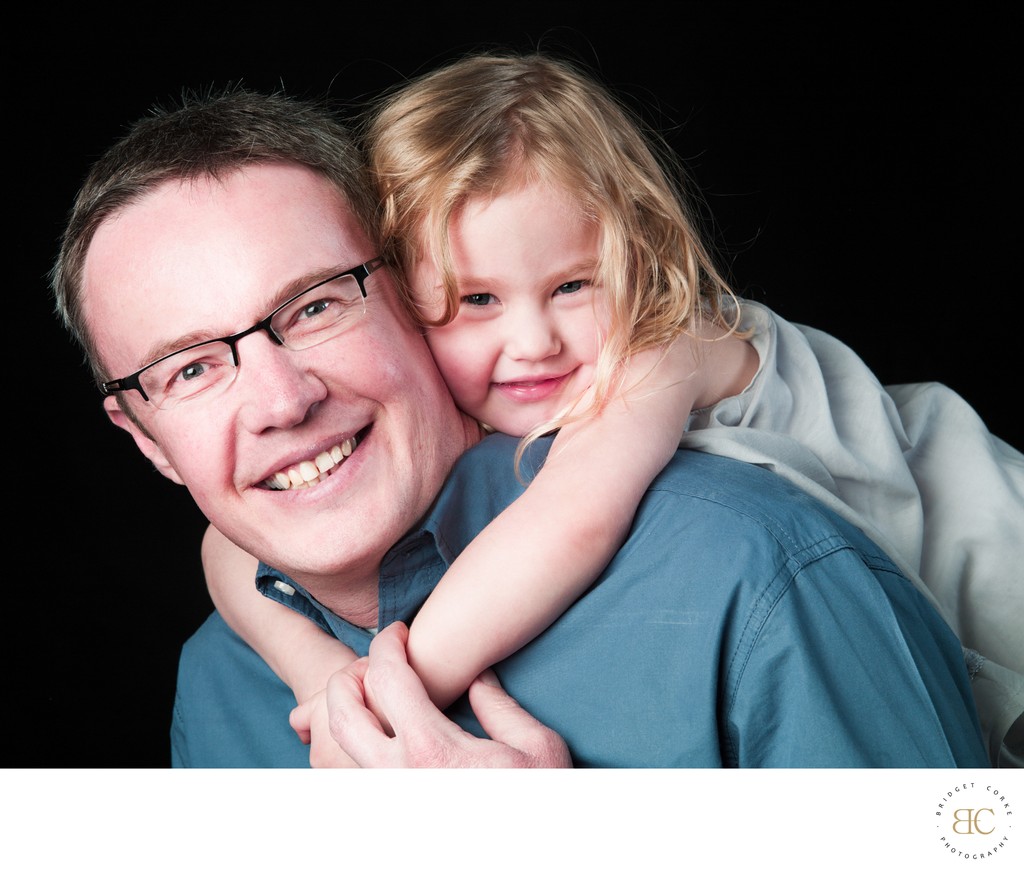 Daughter Hanging Dad Back