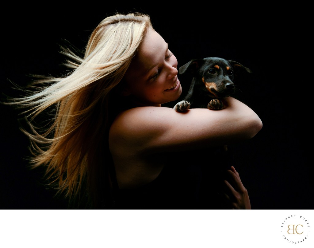 Dachshund On Girls Arm