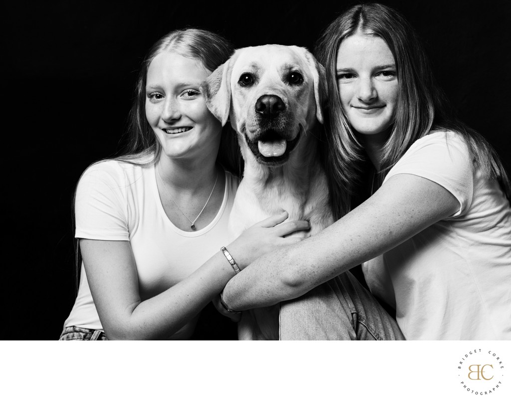 Golden Labrador With Teen Girls