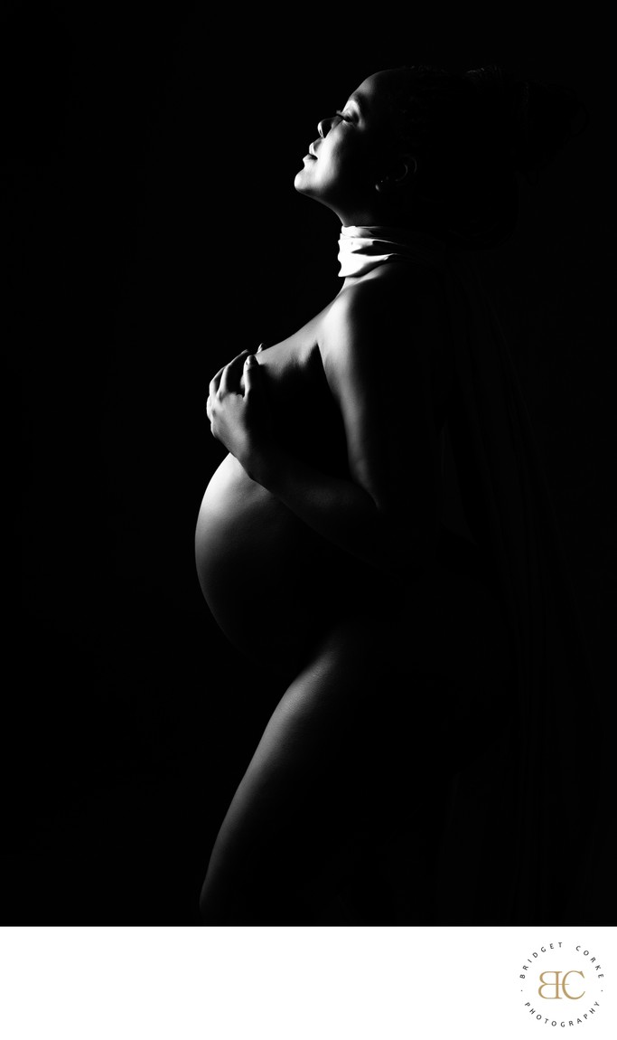 Empowering Black-and-White Maternity Portrait