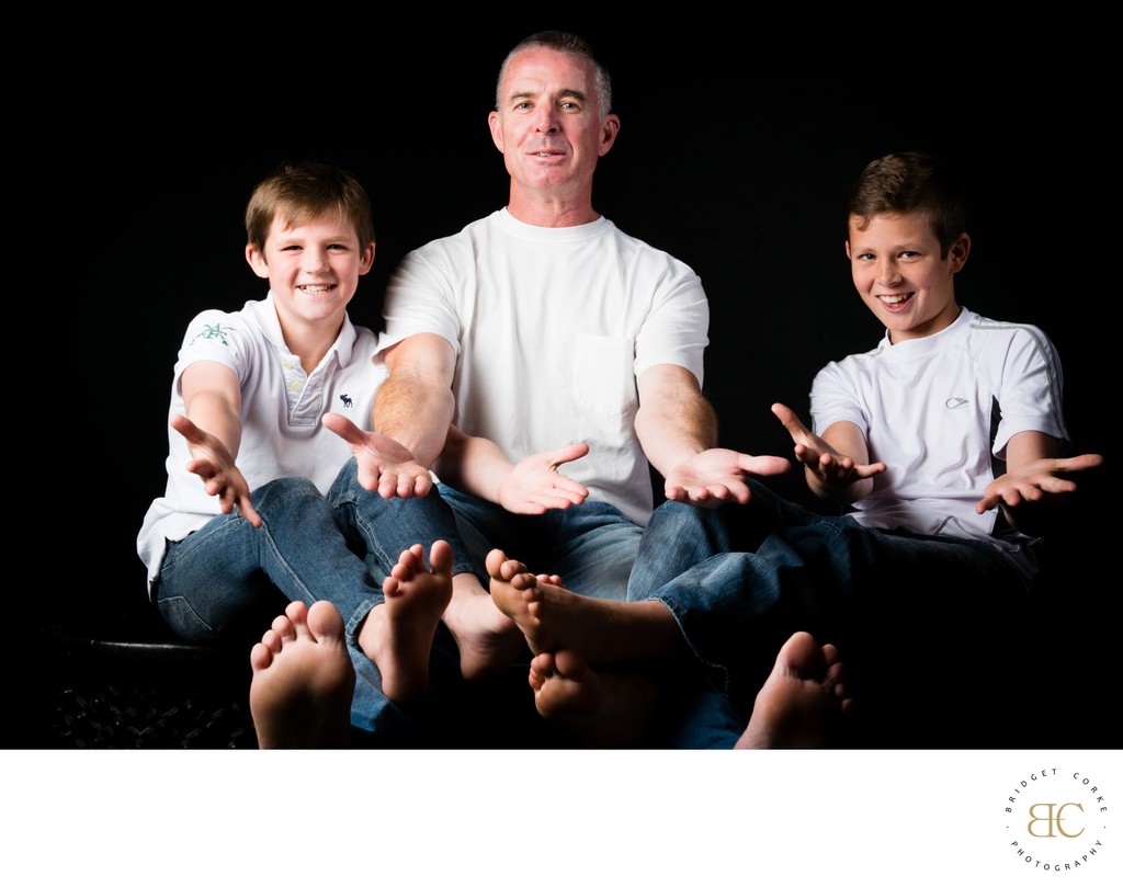 Father and Barefoot Son's Playful Portrait