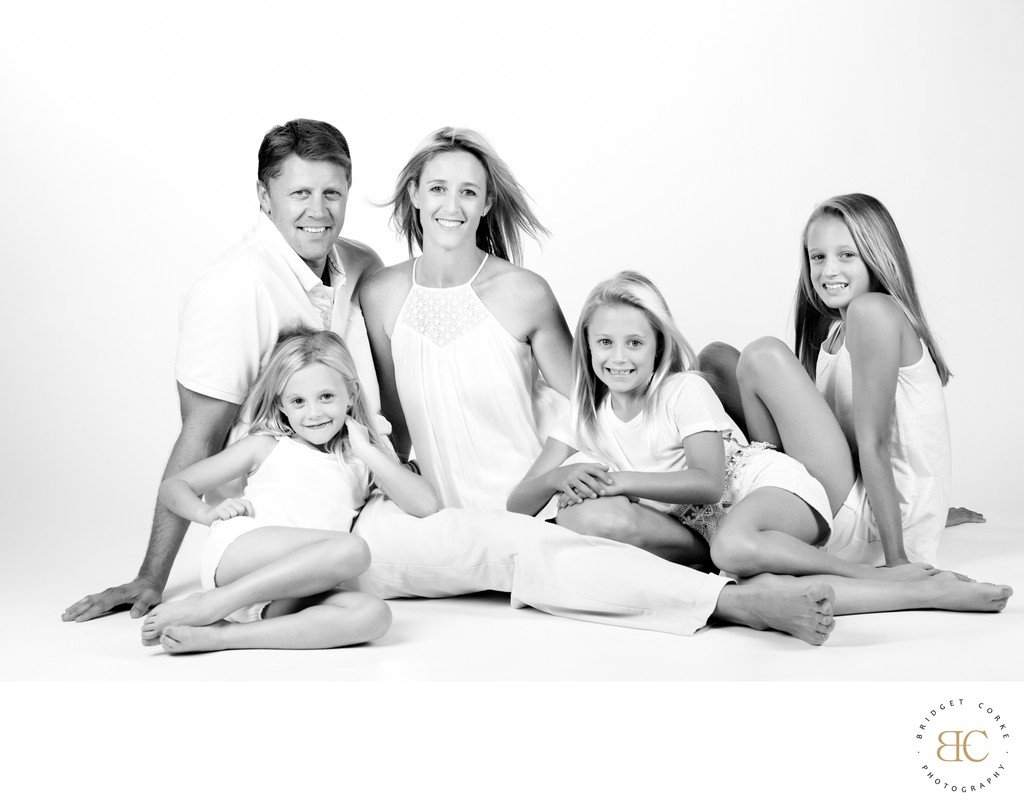 Family in White: A Serene Portrait