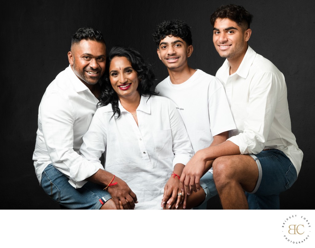 Cheerful Family Portrait in Matching White Outfits