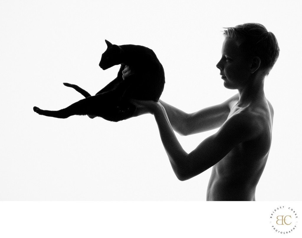 Elegant Silhouette of Boy and Cat - Artistic Portrait