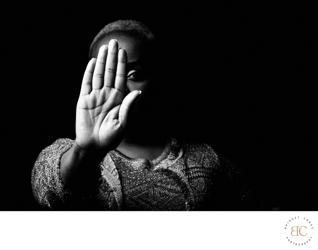 Dramatic Monochrome Portrait with Hand Gesture