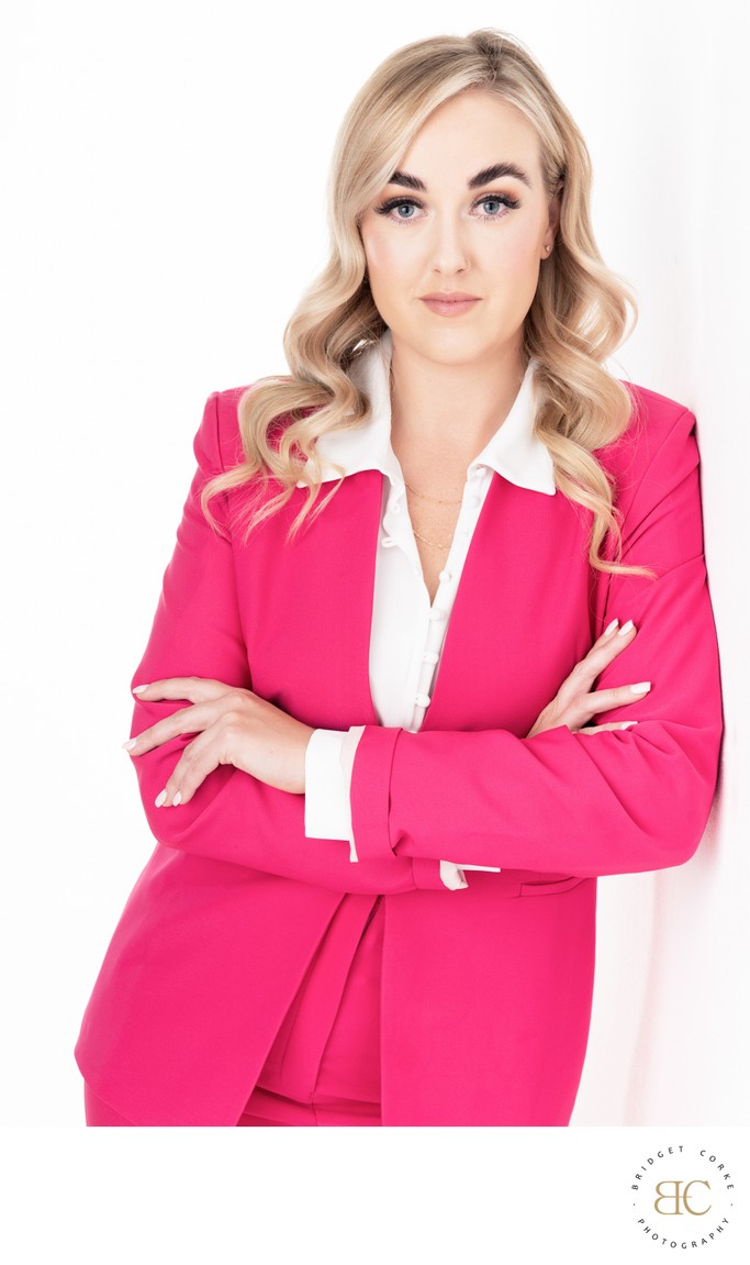 Professional Portrait of a Woman in a Pink Suit