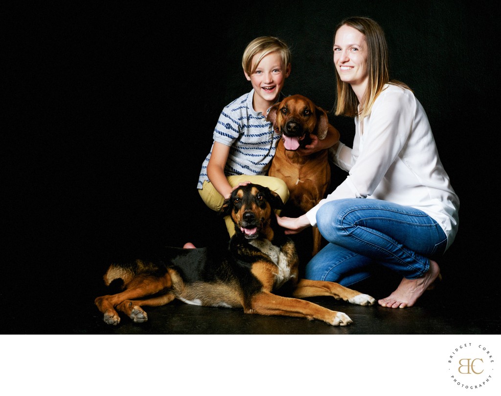 Joyful Family Portrait with Dogs