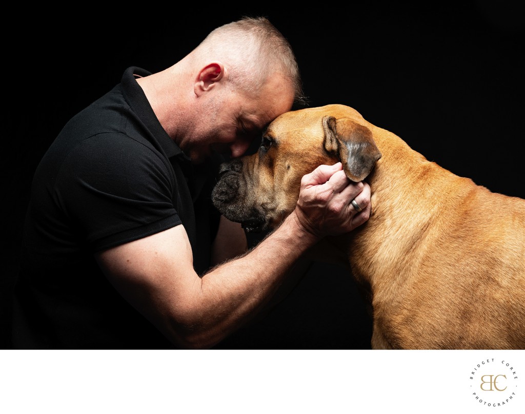 Emotive Portrait of Man and Bull Mastiff 