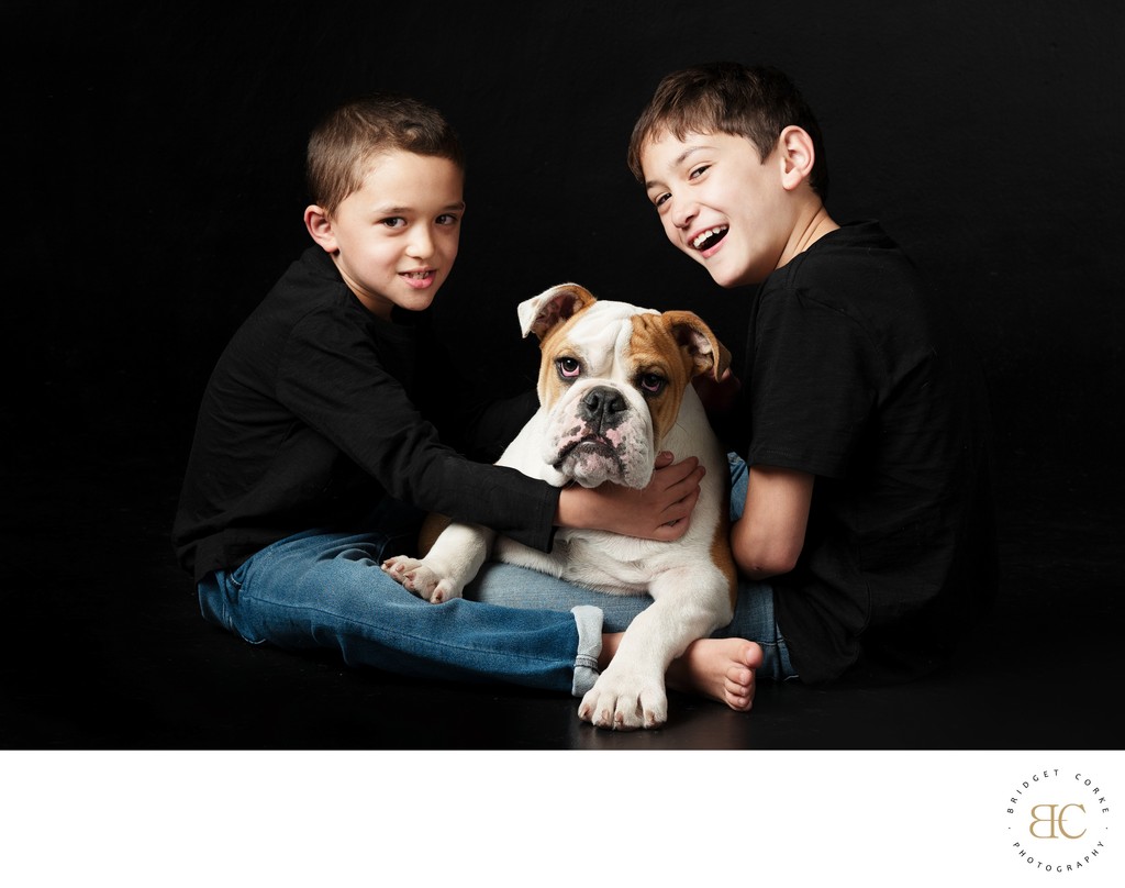 Playful Portrait of Two Boys and a Bulldog