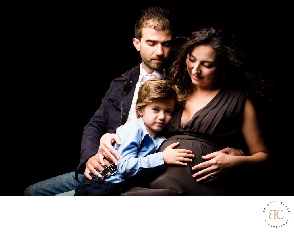 Family Embrace in Maternity Portrait with Young Child