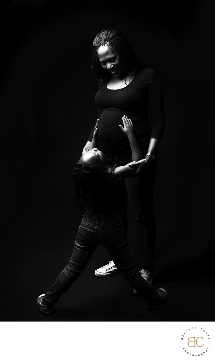 Daughter Admiring Mother's Pregnant Silhouette