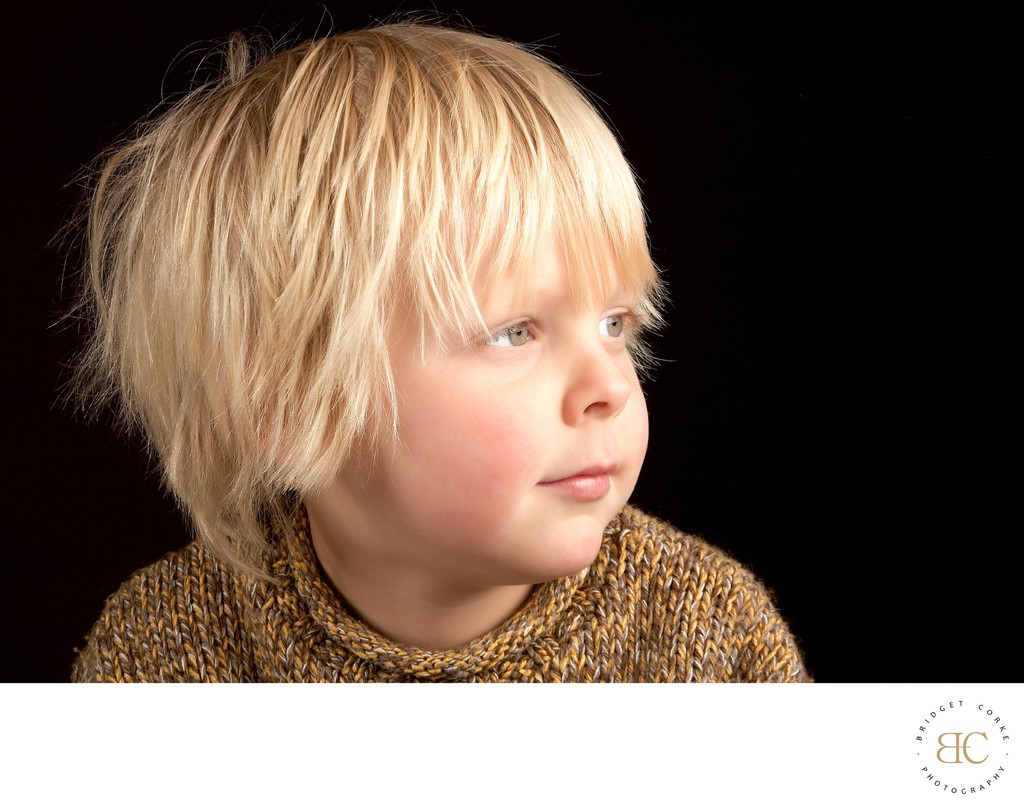 Thoughtful Young Boy: Award-Winning Gaze of Wonder 