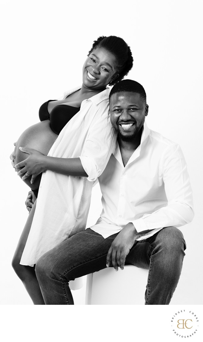 Couple's Joyful Maternity Studio Portrait in B&W