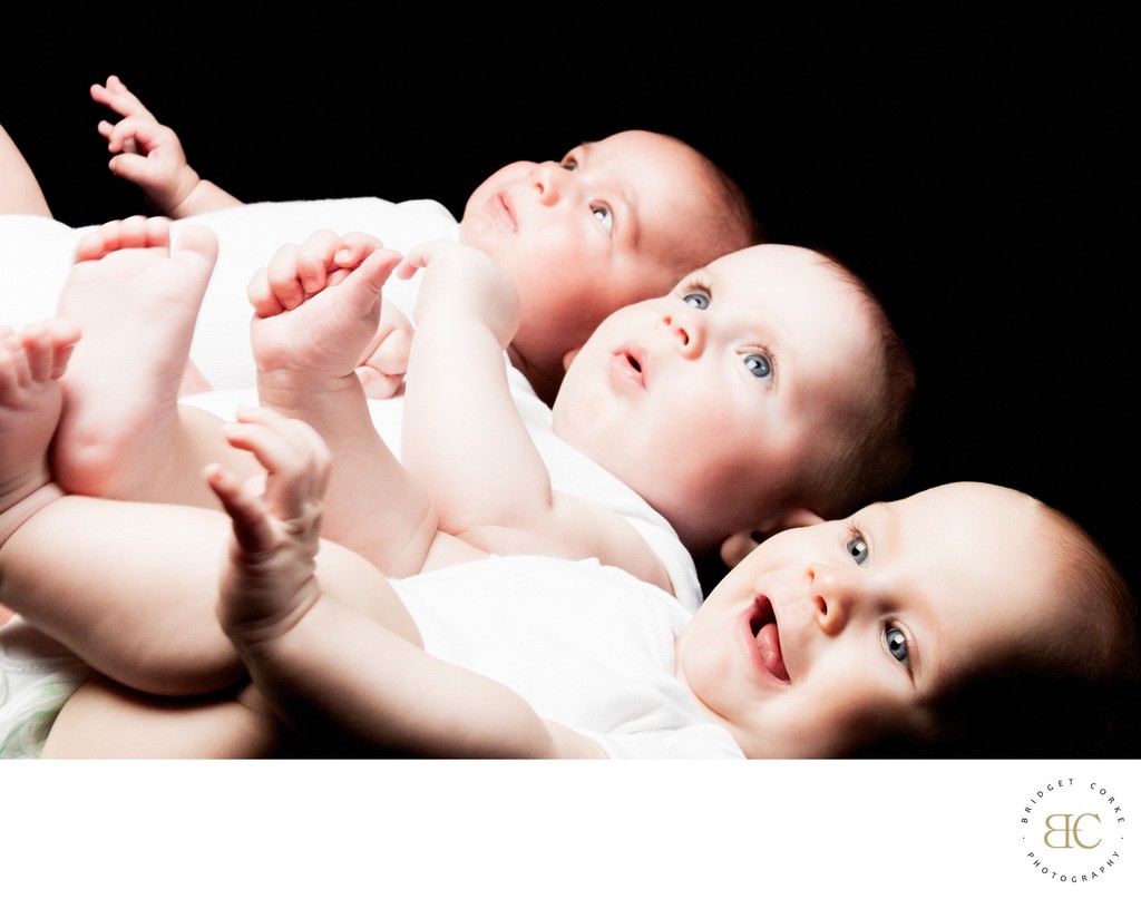 A trio of Joy: Captivating Baby Glances