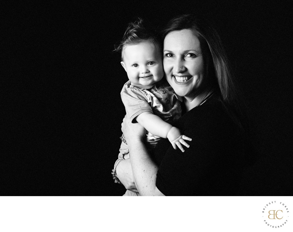 Smiling Mum Holding Her Baby Boy