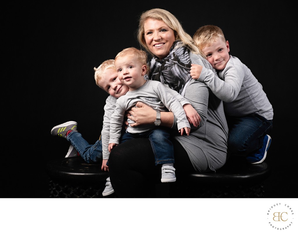 Mum with Her Three Sons in Coordinated Outfits