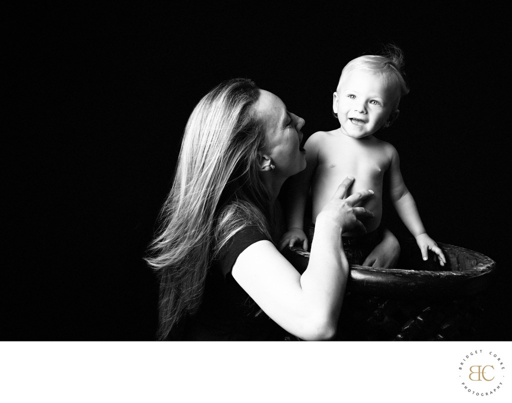 Playful Mum and Baby Son in Studio Light