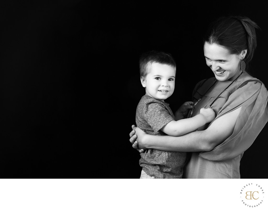 Mum Holding Son in a Quiet, Joyful Moment