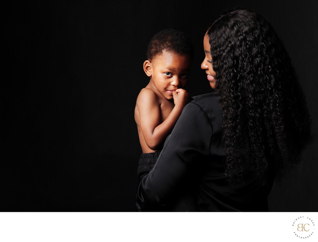 Mum Holding Son with a Quiet, Knowing Look