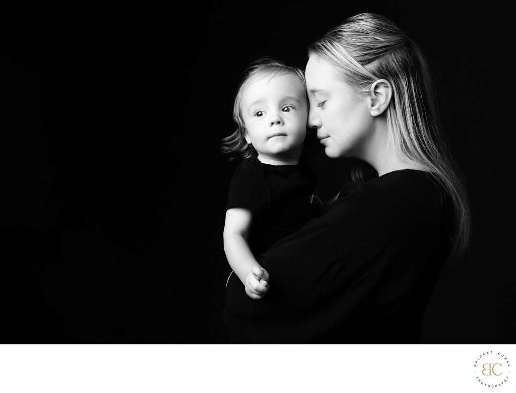 Mother Holding Son in Quiet Black and White