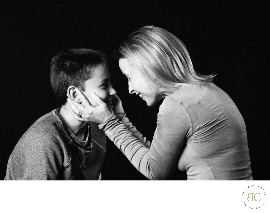 Mother Holding Son’s Face in Gentle Connection