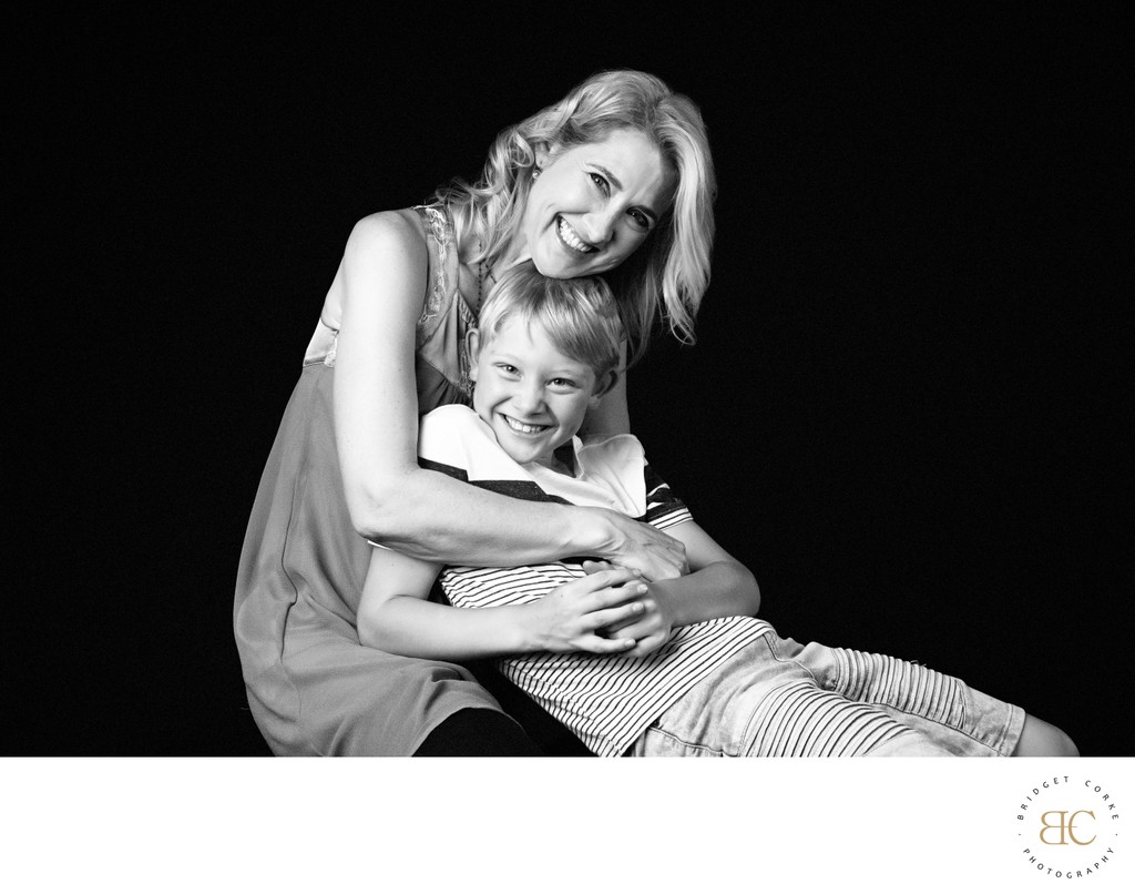Laughing Mum and Son in Studio Hug
