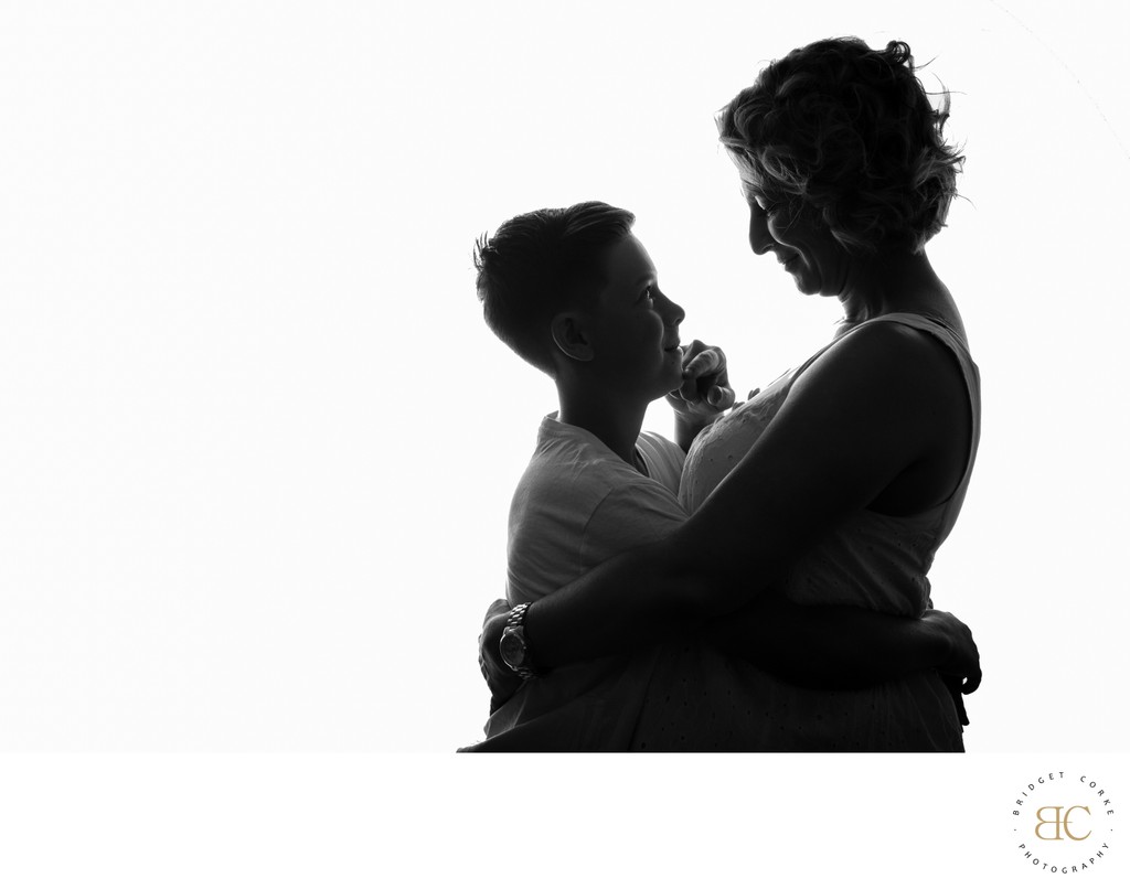 Silhouette of Mother Holding Her Son