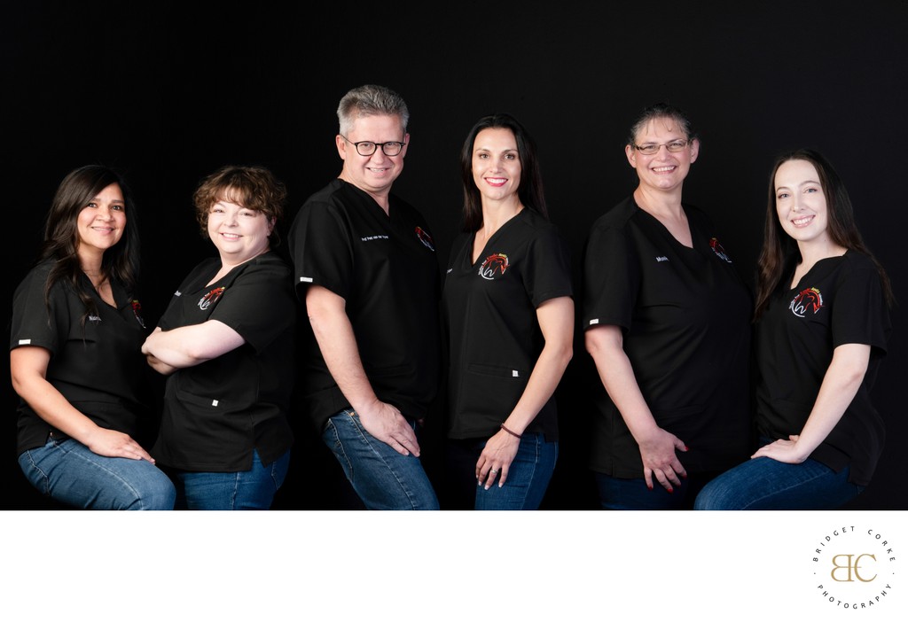 Medical Team Portrait in Branded Black Shirts and Jeans