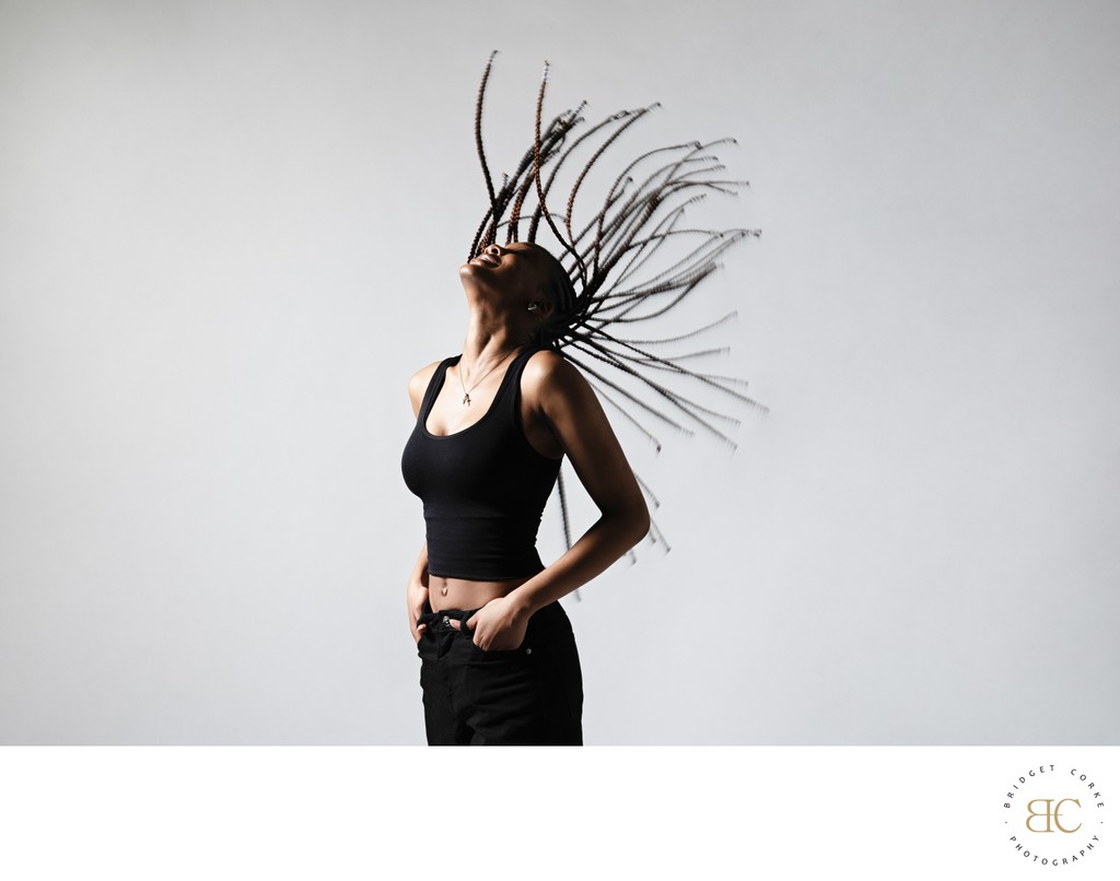 Dynamic Studio Portrait with Braids in Motion