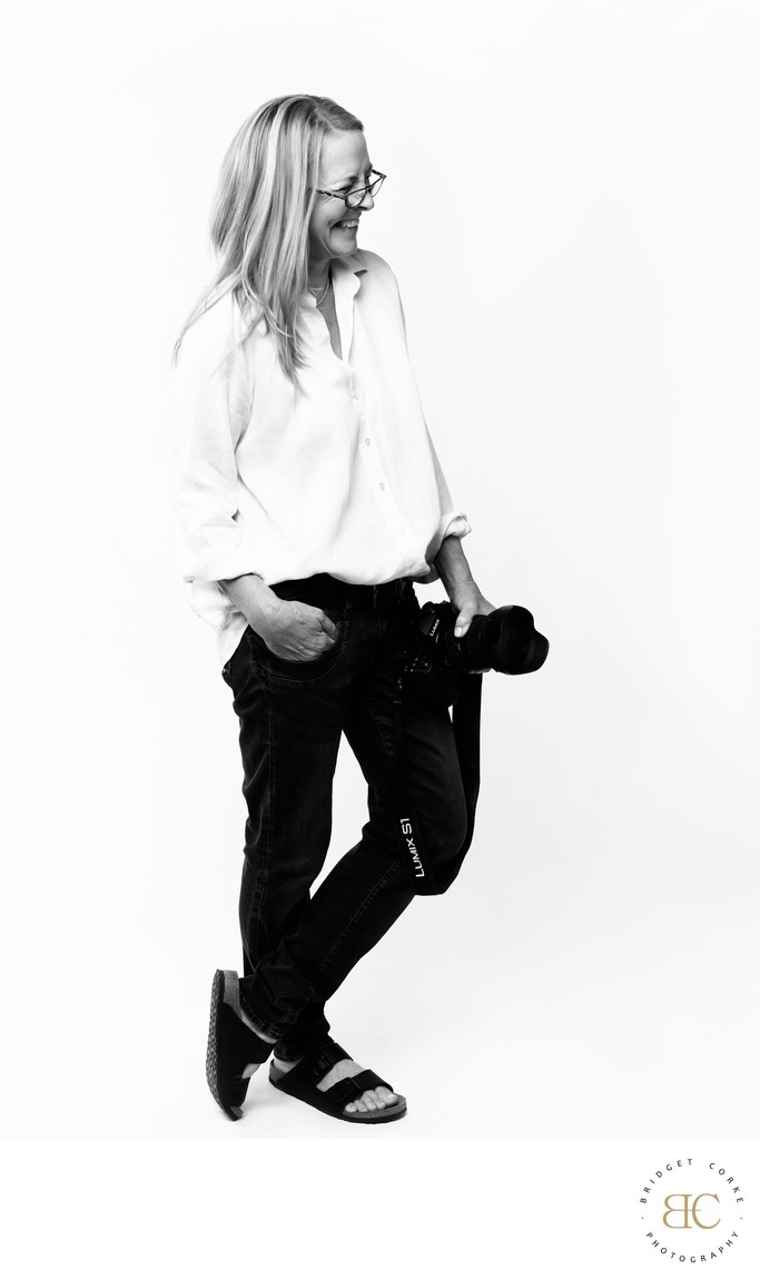 This portrait of Bridget Corke with her camera reflects the calm attention and emotional intelligence behind her Johannesburg portrait work.