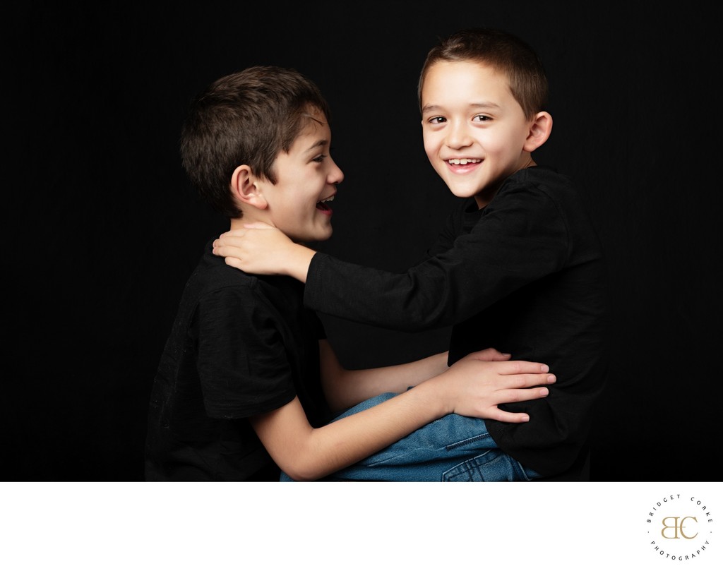 A portrait full of movement and affection, celebrating the spirited connection that exists so naturally between brothers.