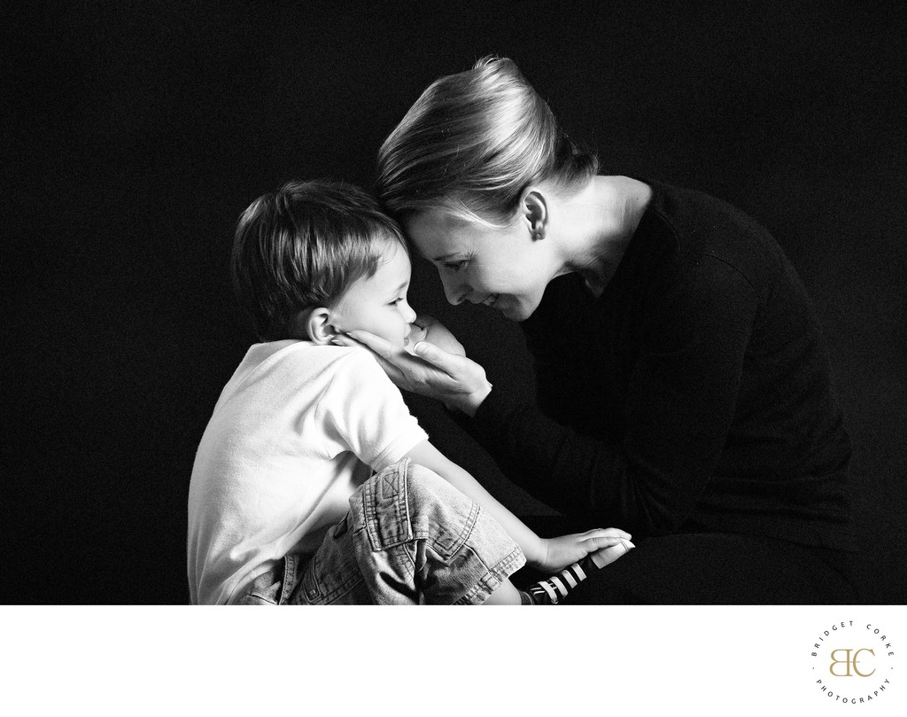 A quiet touch between mother and son