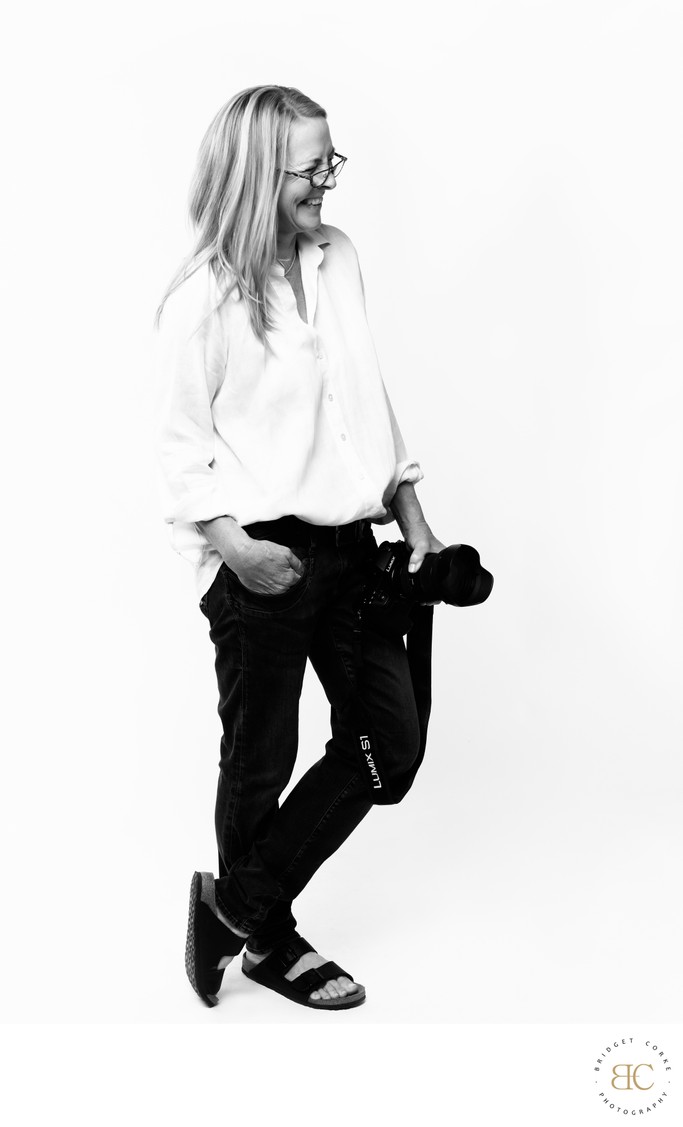Bridget Corke with camera in portrait studio