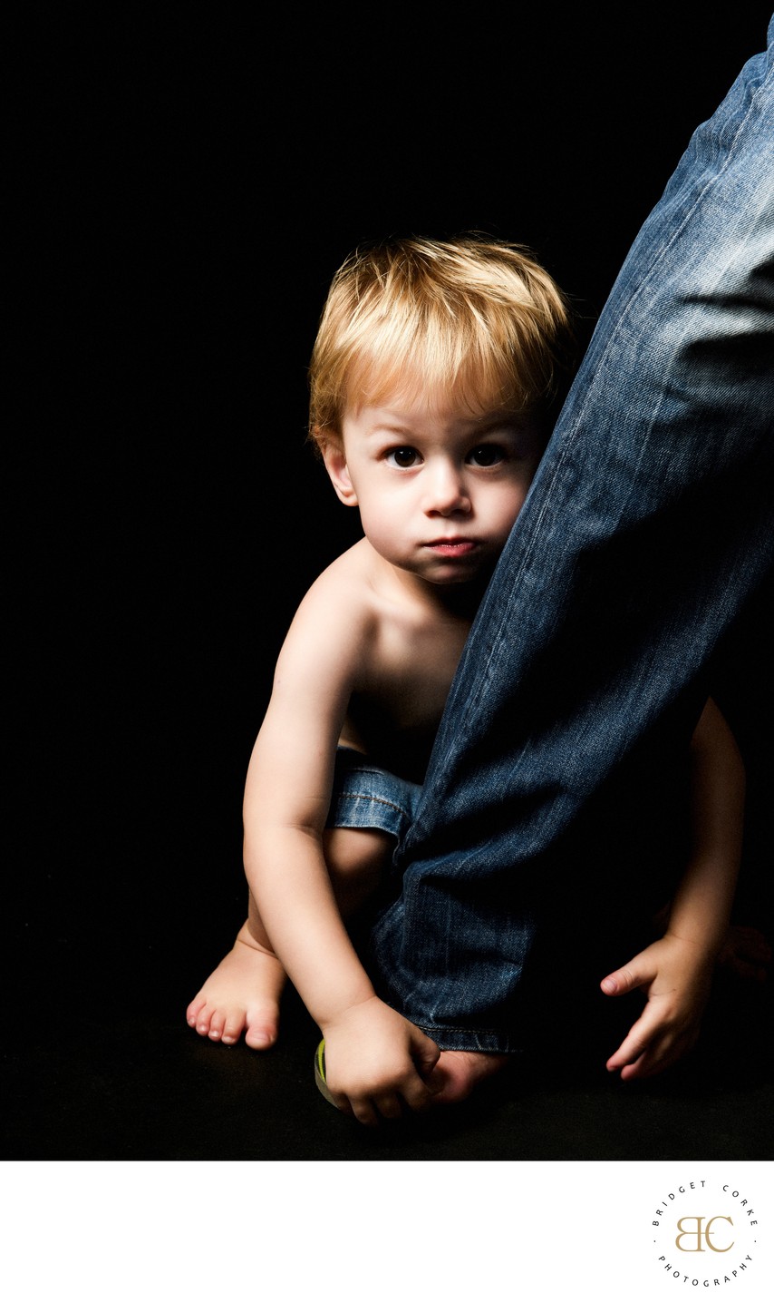 Boy Holding Fathers Ankle