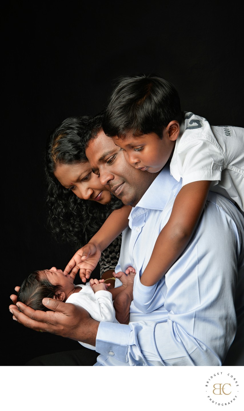 Crying Newborn With His Family