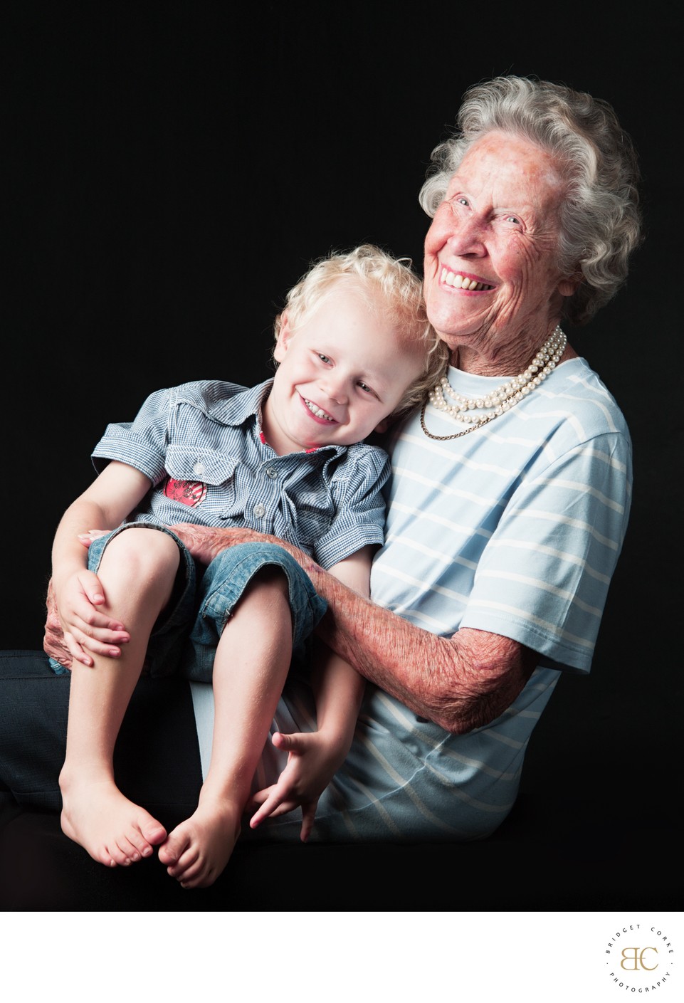 Joyful Grandmother with Grandson Laughing Together