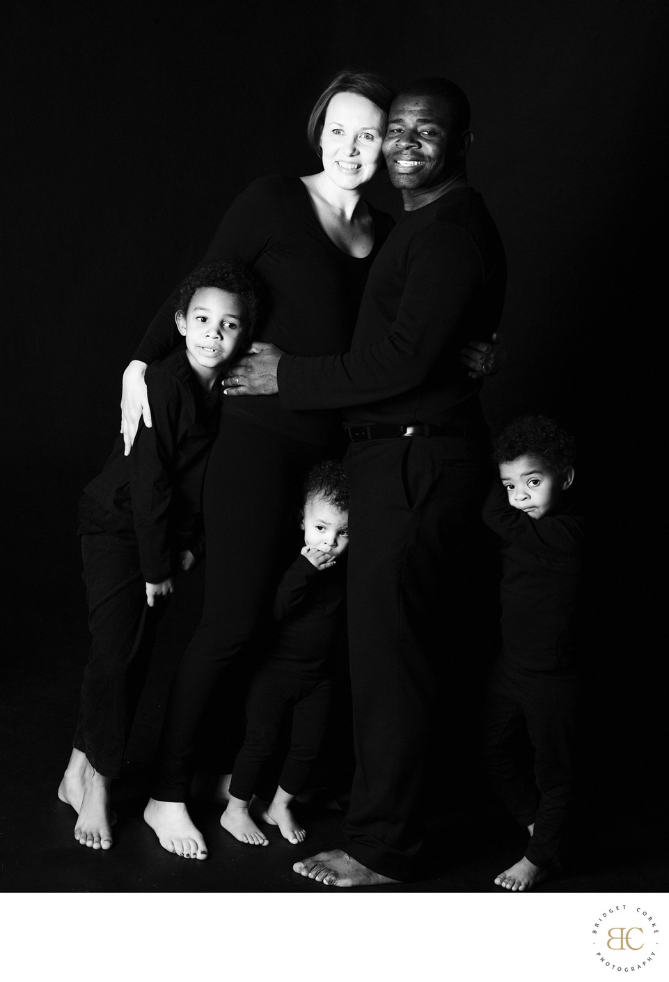 Unified Family Portrait in Elegant Black Attire