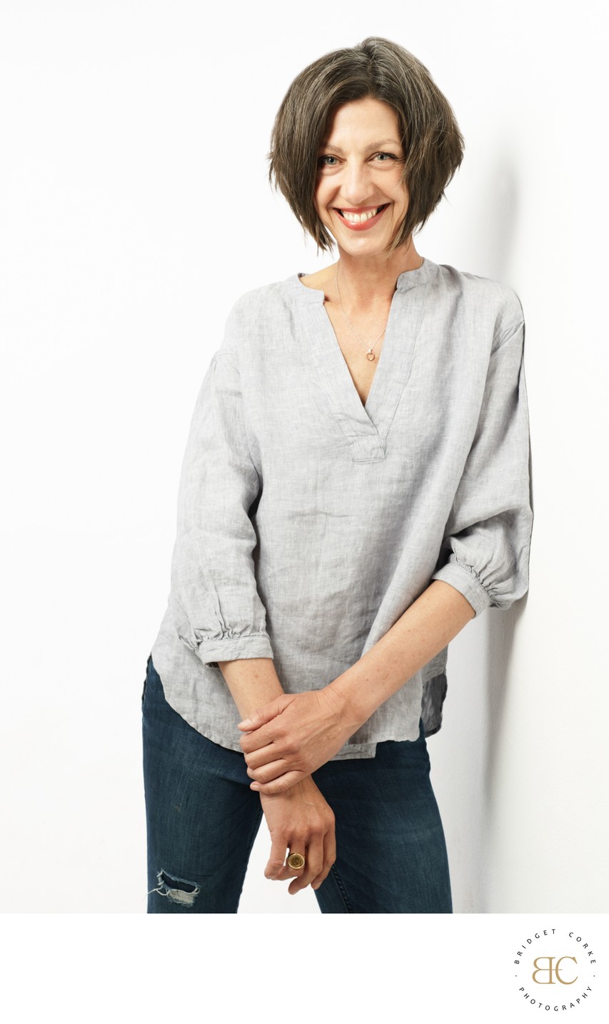 Casual Portrait of a Woman Against White Backdrop