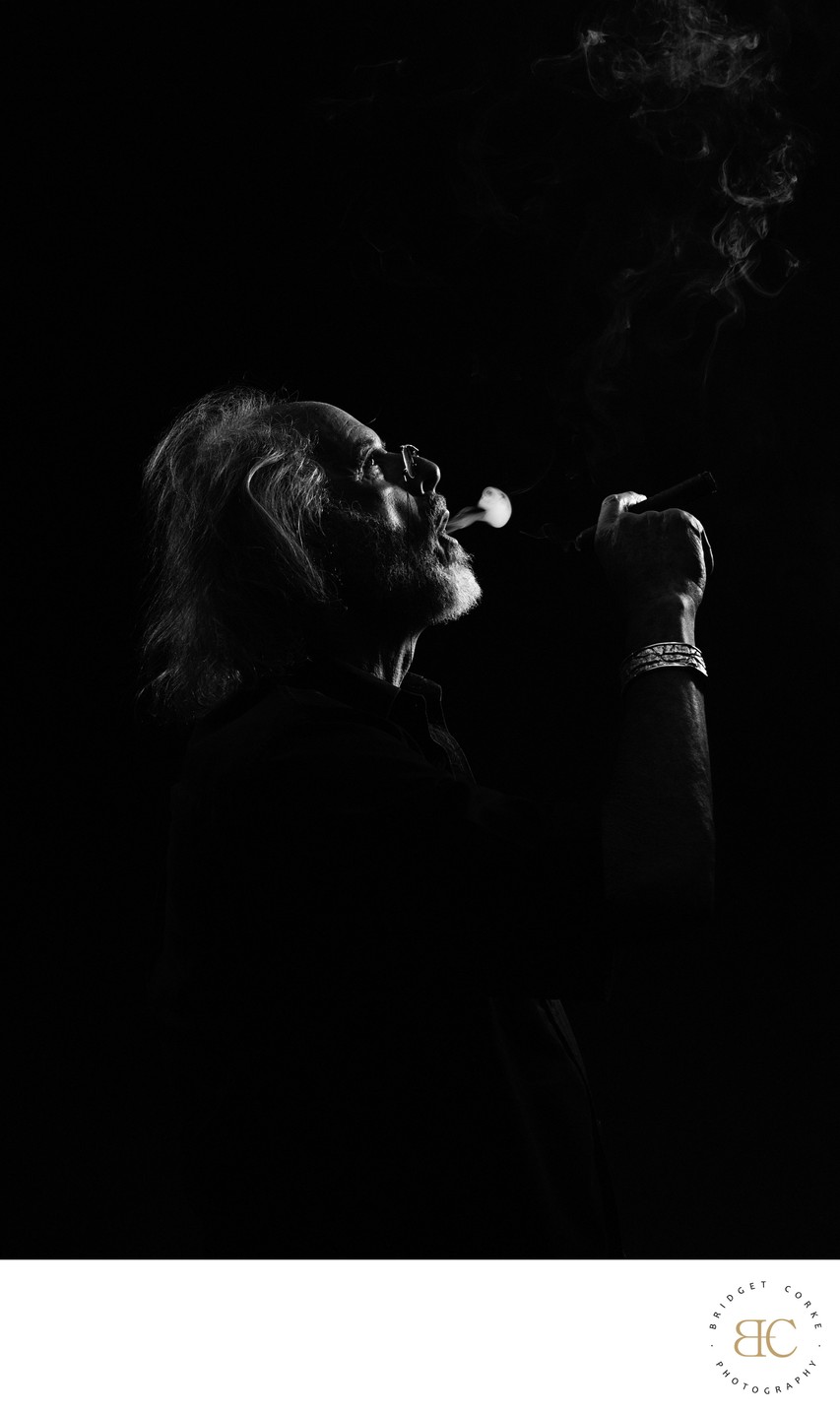 Dramatic Silhouette of a Man Smoking a Cigar