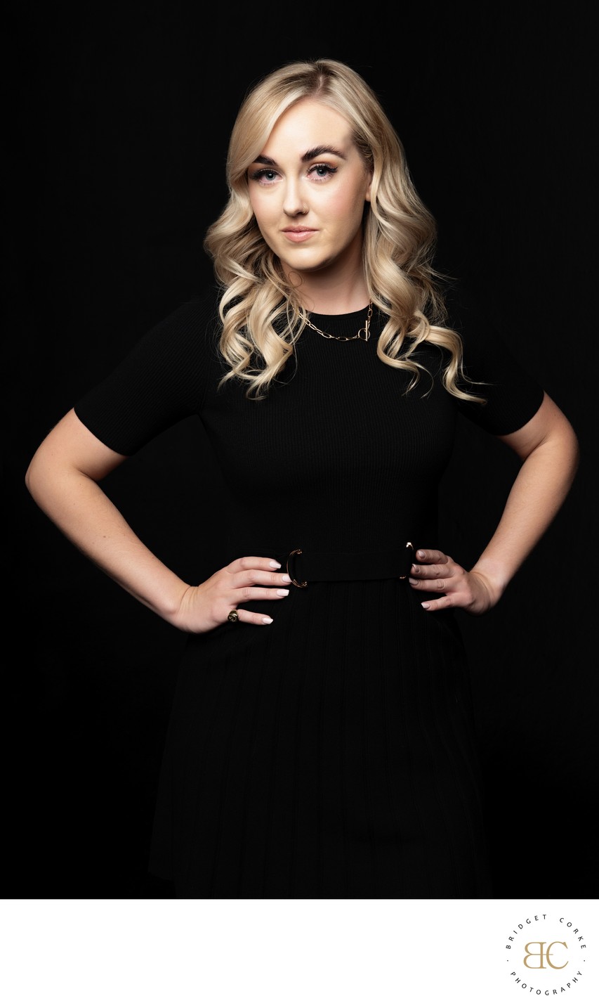 Elegant Portrait of a Blonde Woman in Black Dress