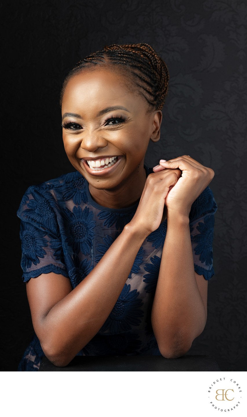 Radiant Portrait of a Woman in Elegant Navy Attire